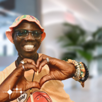 Biodun Chris, striking the 'Inspire Inclusion' pose